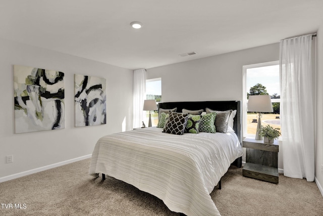 bedroom featuring light colored carpet