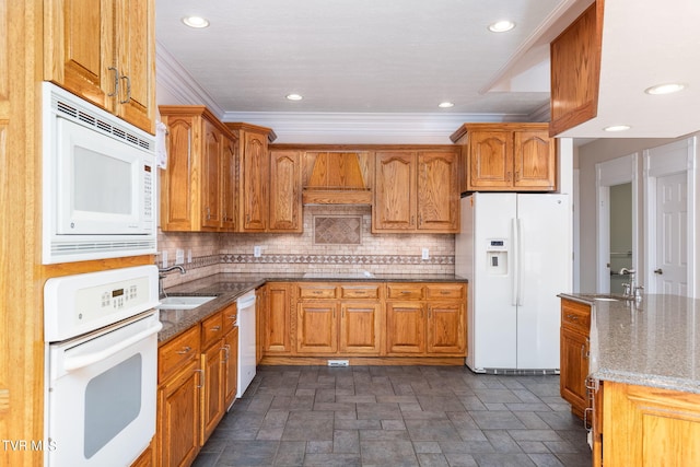 kitchen with premium range hood, sink, tasteful backsplash, white appliances, and dark stone counters