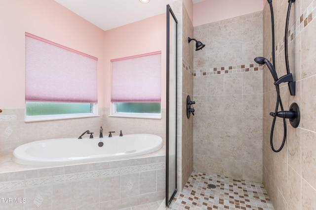 bathroom with separate shower and tub