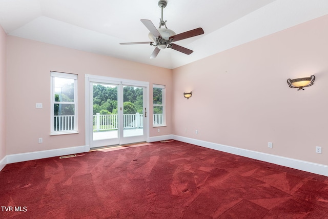 unfurnished room with ceiling fan and carpet flooring