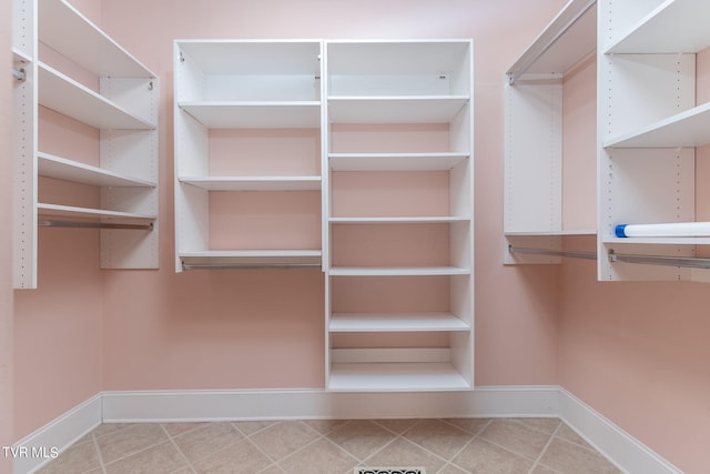 walk in closet featuring tile patterned floors