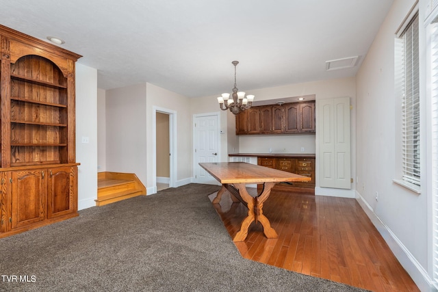 unfurnished dining area featuring a notable chandelier