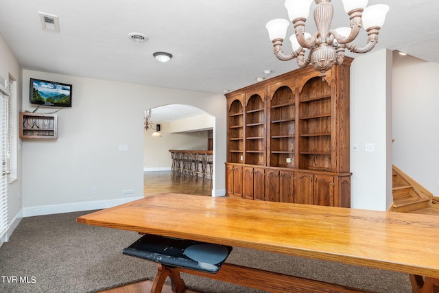 unfurnished dining area with an inviting chandelier