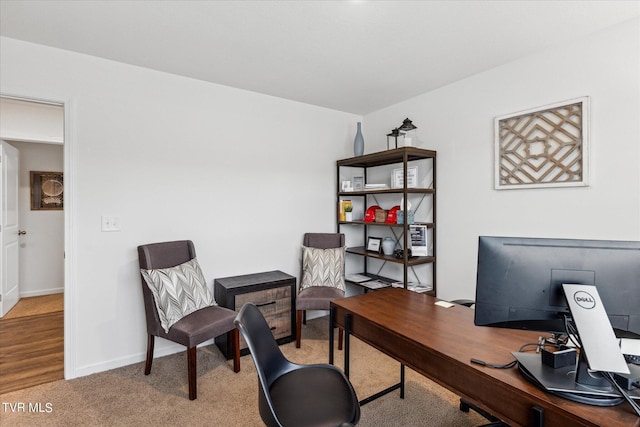 office area featuring light colored carpet