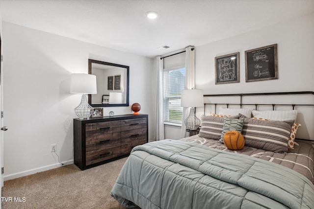 bedroom featuring light carpet