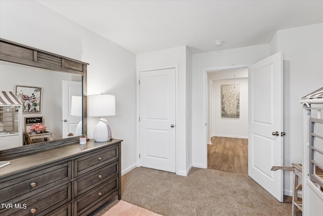 bedroom featuring light carpet