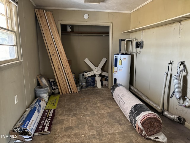 basement with crown molding and water heater