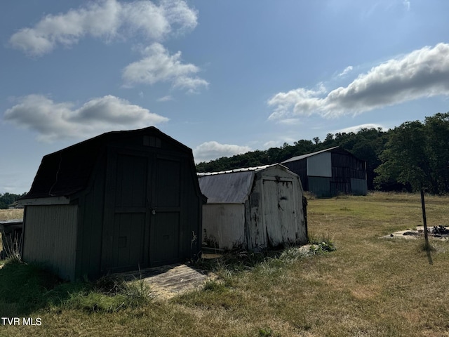 view of outdoor structure featuring a lawn