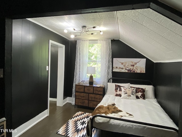 bedroom featuring lofted ceiling and dark wood-type flooring