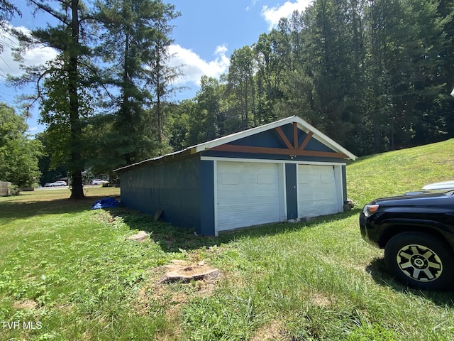 garage featuring a yard