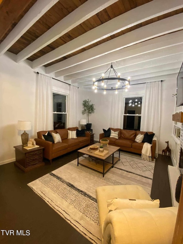 living room with wood ceiling, a stone fireplace, beamed ceiling, and an inviting chandelier