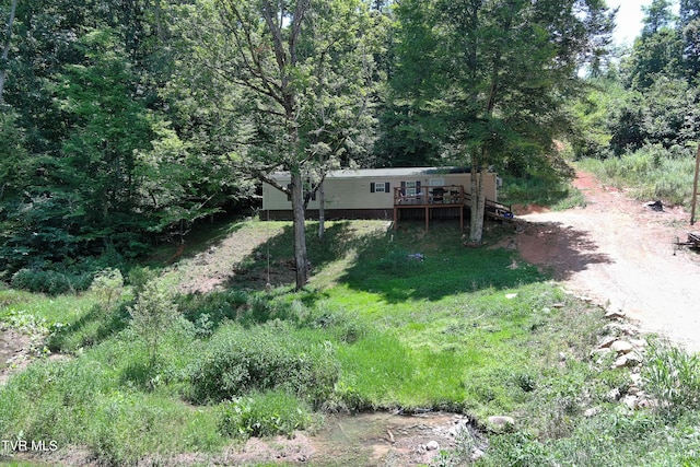 view of yard featuring a wooden deck