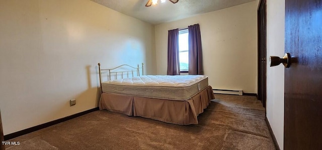 bedroom with lofted ceiling, a baseboard heating unit, dark carpet, and ceiling fan