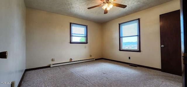 spare room featuring a baseboard radiator, carpet flooring, ceiling fan, and a textured ceiling