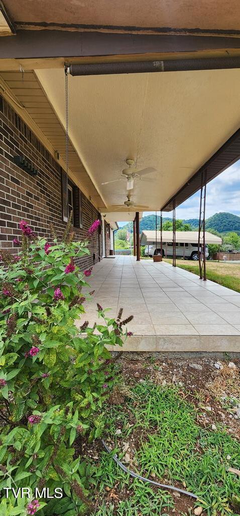 view of patio with ceiling fan