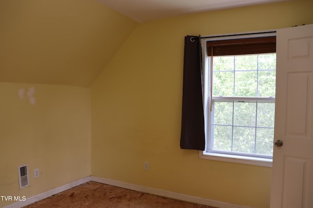 bonus room featuring lofted ceiling