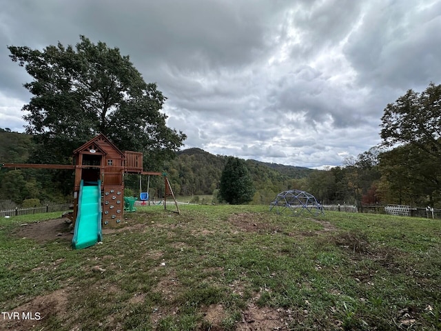2497 Upper Copper Creek Rd, Castlewood, VA 24224 - view of playground featuring a wooded view and fence