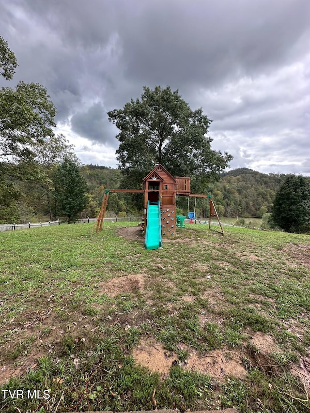 view of playground with a yard