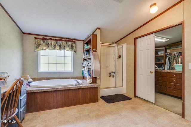 bathroom featuring crown molding, separate shower and tub, and a textured ceiling