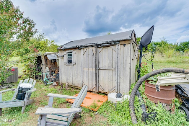 view of outdoor structure with central AC