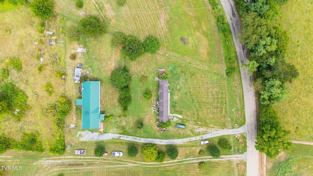 birds eye view of property with a rural view