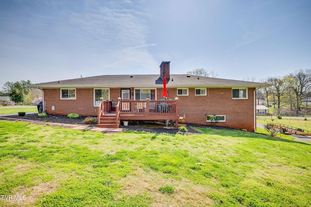 414 Beulah Church Dr, Kingsport, TN 37663 - rear view of house with a chimney, brick siding, a deck, and a lawn