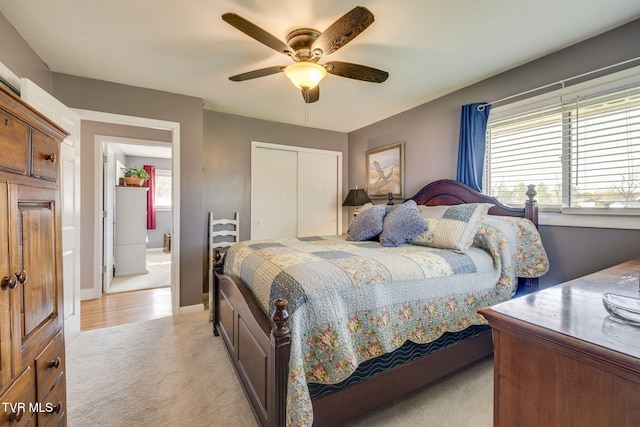 414 Beulah Church Dr, Kingsport, TN 37663 - bedroom featuring light colored carpet, a closet, baseboards, and a ceiling fan