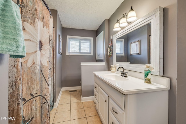414 Beulah Church Dr, Kingsport, TN 37663 - full bath featuring vanity, baseboards, a textured ceiling, tile patterned floors, and visible vents