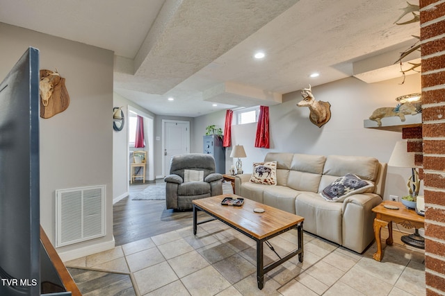 414 Beulah Church Dr, Kingsport, TN 37663 - living area with a textured ceiling, light tile patterned floors, baseboards, visible vents, and recessed lighting