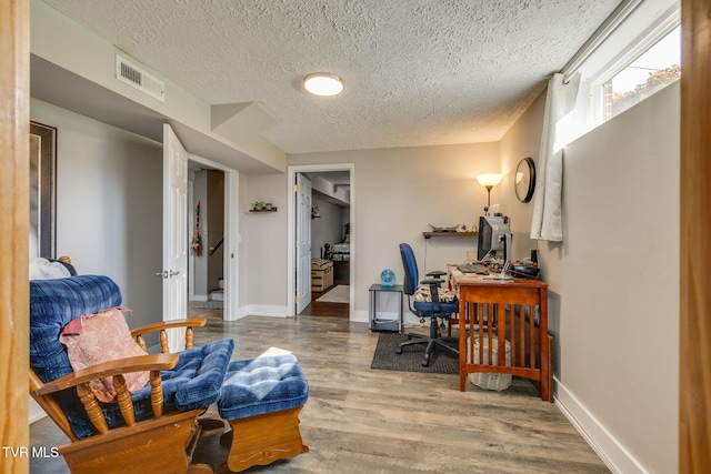 414 Beulah Church Dr, Kingsport, TN 37663 - office featuring baseboards, visible vents, wood finished floors, and a textured ceiling