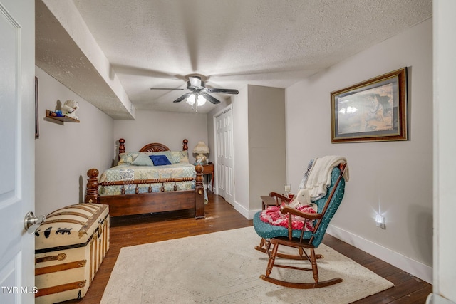 414 Beulah Church Dr, Kingsport, TN 37663 - bedroom with a textured ceiling, baseboards, ceiling fan, and wood finished floors