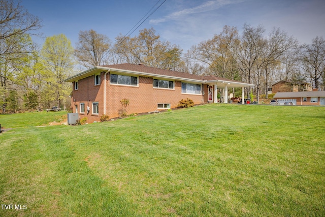 414 Beulah Church Dr, Kingsport, TN 37663 - exterior space featuring an attached carport, a front yard, and brick siding