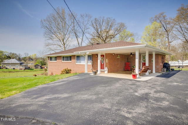 414 Beulah Church Dr, Kingsport, TN 37663 - ranch-style house featuring driveway, entry steps, a front lawn, brick siding, and an attached carport