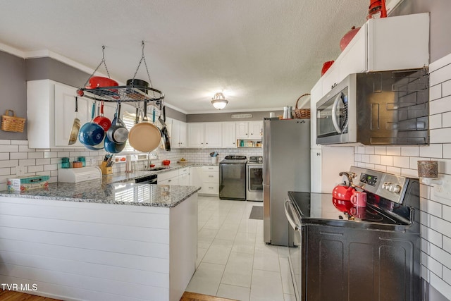 414 Beulah Church Dr, Kingsport, TN 37663 - kitchen featuring crown molding, a peninsula, light stone countertops, stainless steel appliances, and a sink