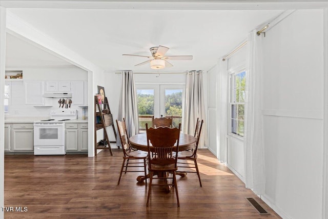 dining space with visible vents, dark wood-style flooring, french doors, and ceiling fan
