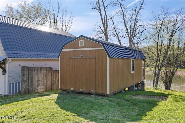 view of shed featuring fence