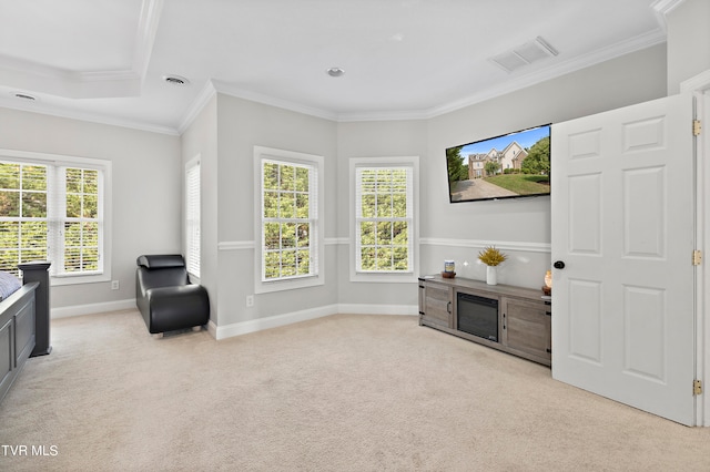 sitting room featuring light colored carpet and crown molding