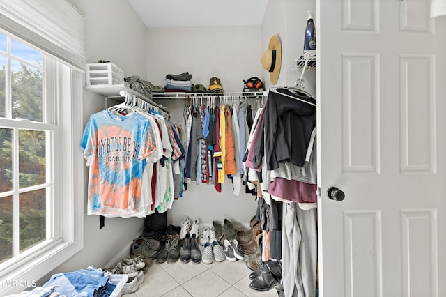 spacious closet featuring light tile patterned floors