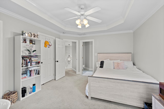 carpeted bedroom with crown molding, a raised ceiling, and ceiling fan