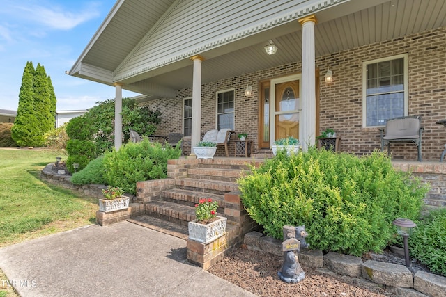 doorway to property featuring covered porch