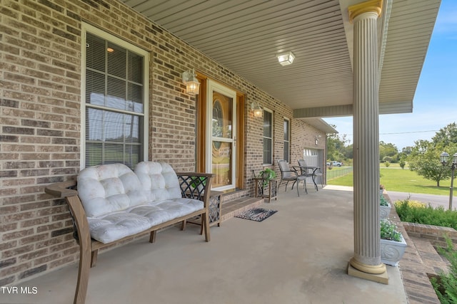 view of patio featuring a porch