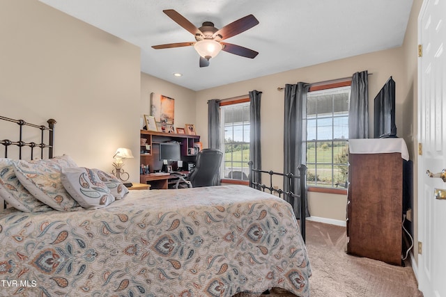 carpeted bedroom featuring ceiling fan