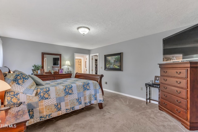 carpeted bedroom with a textured ceiling