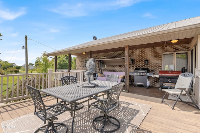 wooden deck with a grill