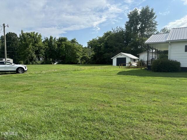 view of yard featuring a garage