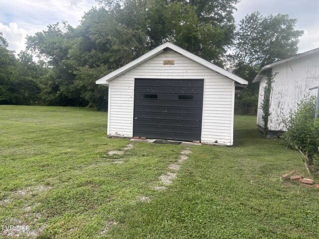 garage featuring a yard