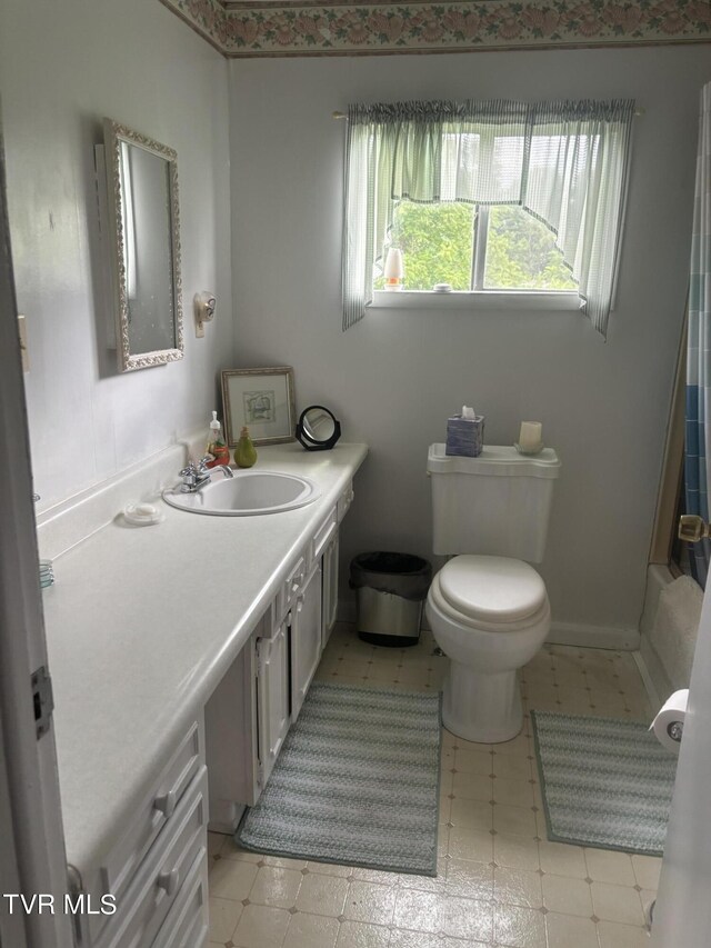 bathroom with vanity and toilet