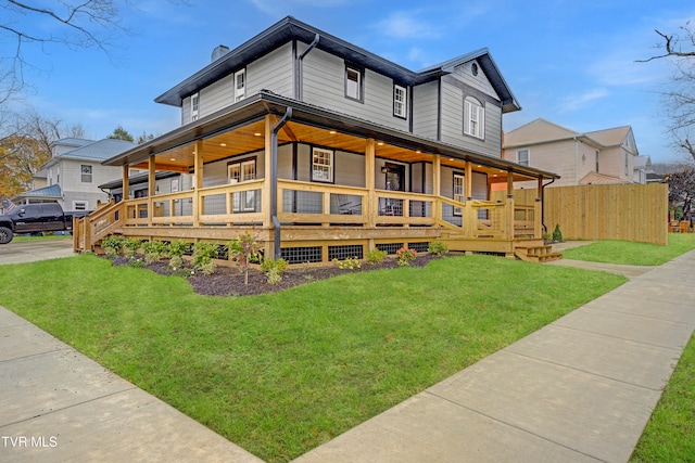 view of side of home with a lawn and a porch