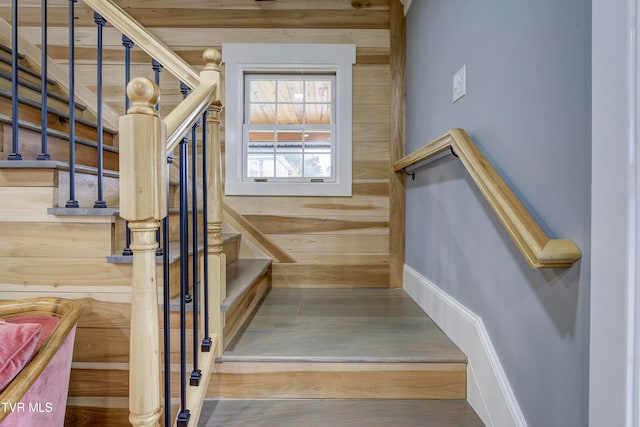 stairway with wooden walls