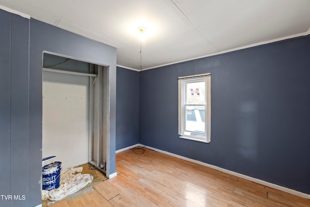 unfurnished bedroom featuring a closet and wood-type flooring